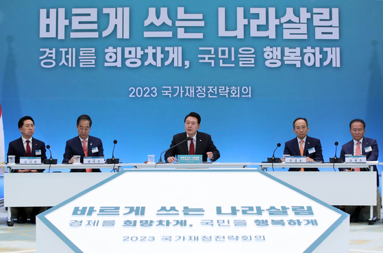 President Yoon Suk Yeol, center, presides over a national fiscal strategy meeting at the Blue House Yeongbingwan in central Seoul Wednesday. [JOINT PRESS CORPS]