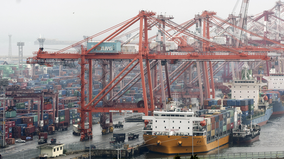 A cargo vessel is anchored at a port in Busan on June 21. [YONHAP]