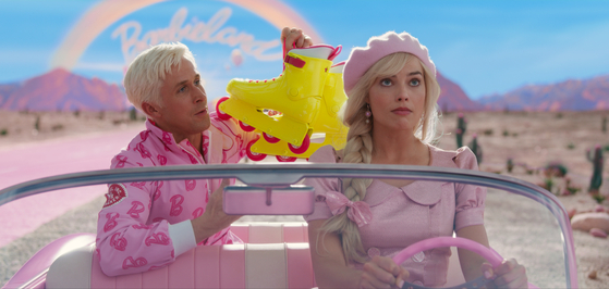 An image from the upcoming film ″Barbie,″ featuring actors Ryan Gosling, left, and Margot Robbie [WARNER BROS. KOREA]