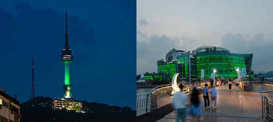 Namsan Seoul Tower in central Seoul, left, and Some Sevit in southern Seoul are lit with green lights Monday to mark 200 days before the 2024 Gangwon Youth Olympics, set to start in Gangwon on Jan. 19, 2024. A total of 1,900 athletes from 70 countries are expected to compete in the Olympics, with 81 medals on the line across 15 different events. [PYEONGCHANG 2018 LEGACY FOUNDATION]  