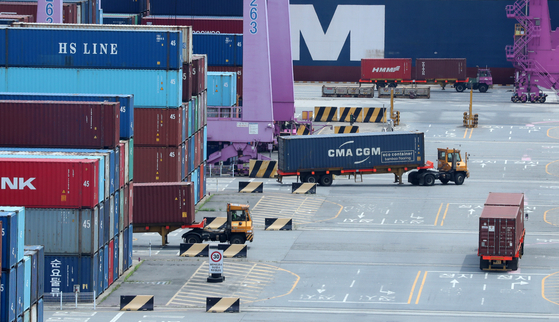 Container boxes are stacked at a port in Incheon on Sunday. [NEWS1]