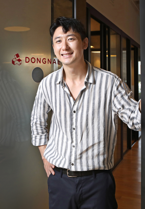 Kim In-song, co-founder and chief strategy officer of DN Korea, poses in front of the company's office in Jung District, central Seoul. [PARK SANG-MOON]