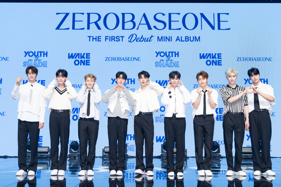 Boy band ZeroBaseOne, also known as ZB1, pose during their debut showcase at Yes24 Live Hall in eastern Seoul’s Gwangjin District on Monday. The band is comprised of the top nine finalists of Mnet’s hit audition show “Boys Planet,” which ended in April. Before even making its official debut, ZeroBaseOne sold over a million copies of its first EP “Youth in the Shade” in preorders, setting a new record for a debuting K-pop act. It is the first K-pop act to reach million-seller status with its first release. [WAKEONE]