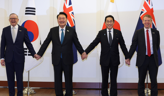 President Yoon Suk Yeol, second from left, poses for a commemorative photo with the leaders of NATO’s Asia-Pacific Partners, or AP4, on the sidelines of the NATO summit in Vilnius, Lithuania on Wednesday. From left are Australian Prime Minister Anthony Albanese, Yoon, Japanese Prime Minister Fumio Kishida and New Zealand Prime Minister Chris Hipkins. [JOINT PRESS CORPS]