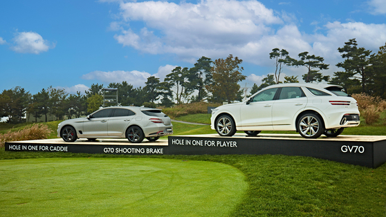 The Genesis GV70 and G70 offered as rewards to players and caddies for hitting a hole in one at the 2022 Genesis Scottish Open are displayed at The Renaissance Club Club in North Berwick, Scotland in July, 2022.  [GENESIS]