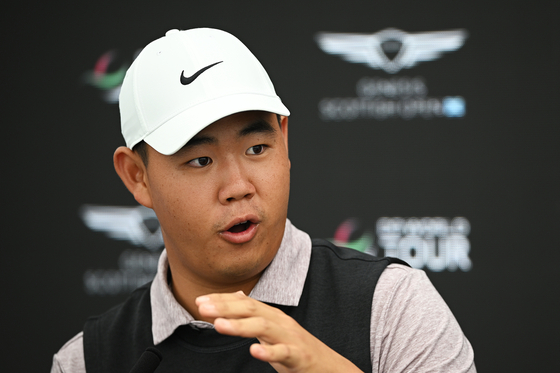 Tom Kim talks to the media during a press conference prior to the Genesis Scottish Open at The Renaissance Club in North Berwich, Scotland on July 12.  [GETTY IMAGES]