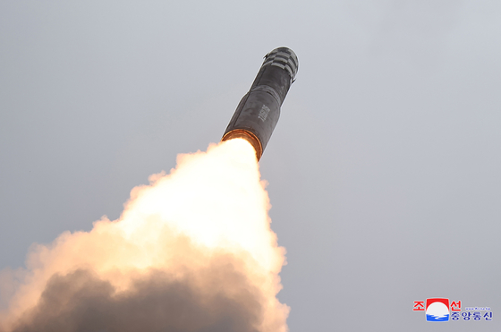 A North Korean Hwasong-18 solid-fuel intercontinental ballistic missile is seen taking off in this photo released by the state-controlled Korean Central News Agency on Thursday. [YONHAP]