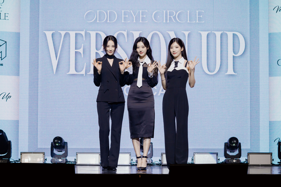 Loona members stand on stage as subunit Odd Eye Circle
