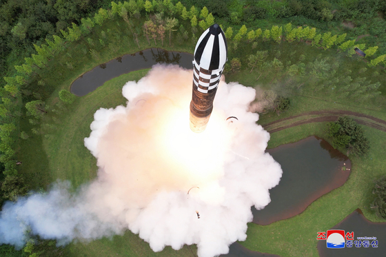 The launch of a North Korean Hwasong-18 solid-fuel intercontinental ballistic missile on Wednesday is captured in this overhead photo released by Pyongyang’s state-controlled Korean Central News Agency on Thursday. [YONHAP]