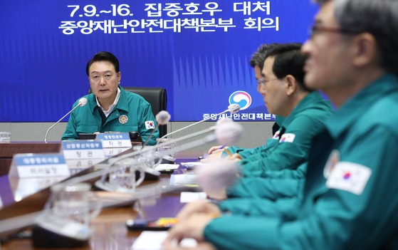 President Yoon Suk Yeol presides over a meeting of the Central Disaster and Safety Countermeasures Headquarters to respond to the recent torrential rains resulting in many casualties at the government complex in central Seoul on Monday morning. [JOINT PRESS CORPS]