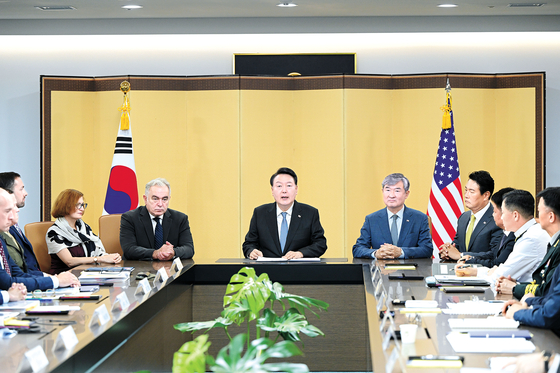 President Yoon Suk Yeol, center, speaks at the inaugural meeting of the Nuclear Consultative Group, alongside U.S. National Security Council Coordinator for Indo-Pacific Affairs Kurt Campbell, left of Yoon, at the Yongsan presidential office in central Seoul on Tuesday. [PRESIDENTIAL OFFICE]