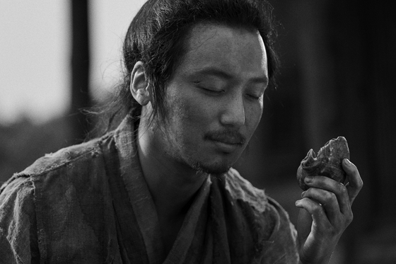 Actor Byun Yo-han as Chang-dae, an ambitious fisherman in the black-and-white historical film ″The Book of Fish″ (2021) [MEGABOX PLUS M]