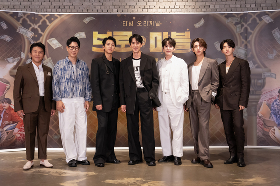 From left, Cho Sae-ho, Jee Seok-jin, Lee Seung-gi, Yoo Yeon-seok, Kyuhyun, Joshua and Hoshi of boy band Seventeen pose for a photo during an online press conference for ″Bro & Marble in Dubai″ on Monday. [TVING]