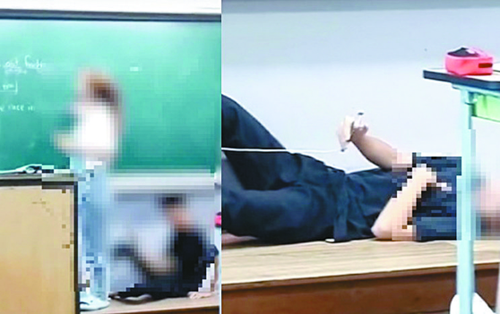 A middle school student in Hongseong, South Chungcheong, watching TikTok videos while lying beneath a blackboard while a teacher continue with her class in August 2022. [TIKTOK SCREEN CAPTURE]