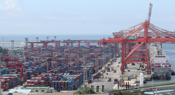 Containers for export and import are stacked at a port in Busan on Tuesday. [NEWS1]