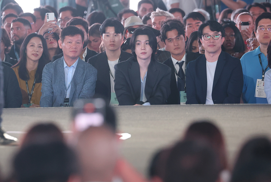 Suga is in the front row of the Unpacked event on Wednesday. [YONHAP]