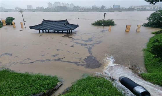 Gongsanseong Fortress located in Gongju, South Chungcheong, is seen submerged in water, leaving only the roof of Manharu pavilion exposed on Saturday. [YONHAP]