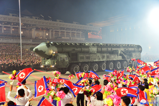A Hwasong-18 solid-fuel intercontinental ballistic missile is seen in this photo of a nighttime military parade in Kim Il Sung Square in downtown Pyongyang on Thursday that was later released by the North's state-controlled Korean Central News Agency on Friday. [YONHAP]