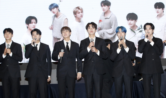 Boy band Infinite poses for photos during a press conference held on Monday at The Riverside Hotel in southern Seoul in celebration of its new album, ″13egin.″ [NEWS1]