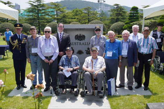 Australian veterans of the 1950-53 Korean War and Australian Minister of Veterans' Affairs and Defense Personnel Matt Keogh, fourth from left, mark the 70th anniversary of the end of the war last Thursday by paying tribute to the veterans interred at the UN Memorial Cemetery in Korea in Busan. [EMBASSY OF AUSTRALIA IN KOREA]