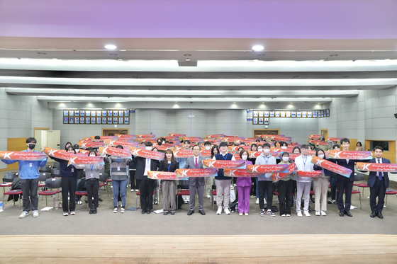 Volunteer workers for the Cheonan K-Culture Expo 2023 pose for a photo. [CHEONAN CITY]