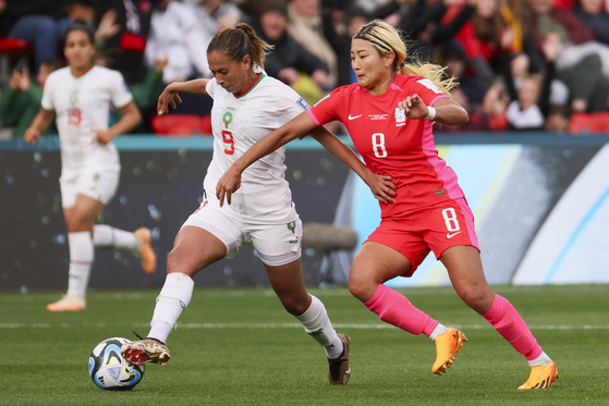 Korea's Cho So-hyun, right, competes for the ball with Morocco's Ibtissam Jraidi during a 2023 FIFA Women's World Cup Group H match in Adelaide, Australia on Sunday. [AP/YONHAP] 