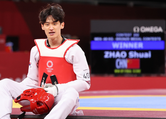 Lee Dae-hoon reacts after losing to Zhao Shuai of China in the bronze medal match in the men's 68kg Taekwondo event at the Tokyo Olympics at Makuhari Messe Hall A in Chiba, Japan on July 25, 2021. [NEWS1] 