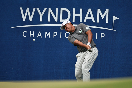 An Byeong-hun chips onto the 15th green during the final round of the Wyndham Championship at Sedgefield Country Club on Sunday in Greensboro, North Carolina. [GETTY IMAGES]