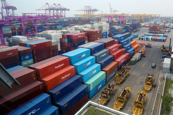 Containers are unloaded at a port in Incheon on June 9. [NEWS1]