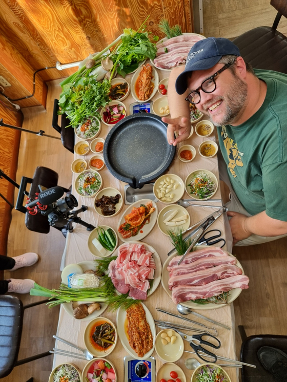 Givens poses for a photo while filming content for his YouTube channel "Eating What is Given." [AUSTIN GIVENS]