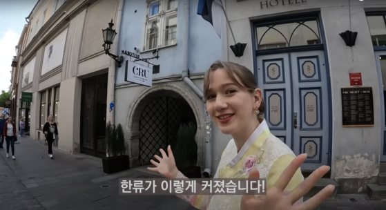 Mai tries out hanbok, the Korean traditional dress, in her hometown in Estonia. [KIMCHI GHOST MAI]