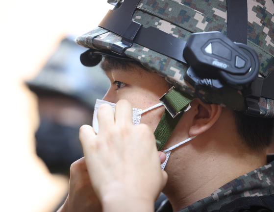 A reserve in uniform and helmet at a training center in Seol in June. [YONHAP]