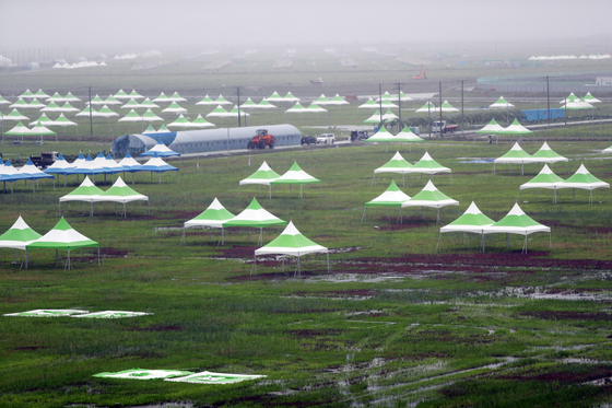 Puddles of water are visible across the Jamboree campsite in Saemangeum, North Jeolla, after a heavy rainfall on July 18, a fortnight before the event. [YONHAP] 