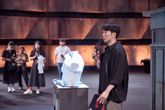 Main producer of ″Physical:100″ Jang Ho-gi speaks during a press event to introduce the set of the second season of the popular Netflix reality television show at Kintex in Goyang, Gyeonggi, on Wednesday. [NETFLIX]