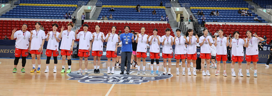 WKBL team Busan BNK Sum pose with their silver medals after finishing second at the 2023 William Jones Cup in Taipei, Taiwan on Wednesday.  [WILLIAM JONES CUP]