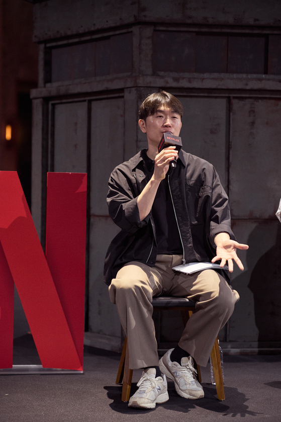 Main producer of ″Physical:100″ Jang Ho-gi speaks during a press event to introduce the set of the second season of the popular Netflix reality television show at Kintex in Goyang, Gyeonggi, on Wednesday. [NETFLIX]           