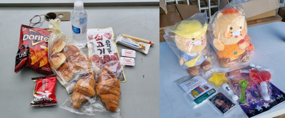 The contents of the gift bag attendees were given including the dinner, at left, and merchandise from HYBE, Kakao Entertainment and the Ministry of Culture, Sports and Tourism at right [YOON SO-YEON]