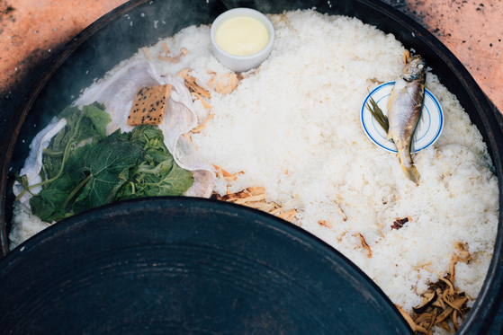 Fresh and preserved namul (seasoned greens), dried fi sh and tofu in a large gamasot (cauldron) in Mungyeong, North Gyeongsang. [YOLANTA SIU]