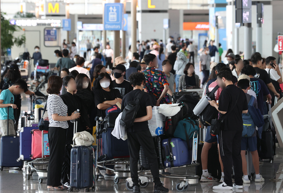 Incheon International Airport, west of Seoul, is packed with travelers in this file photo taken Aug. 6, 2023. 