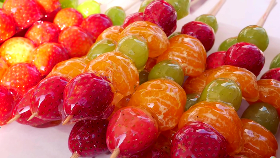 Tanghulu, a famous Chinese snack with candied caramelized fruits on a stick [SHUTTERSTOCK]