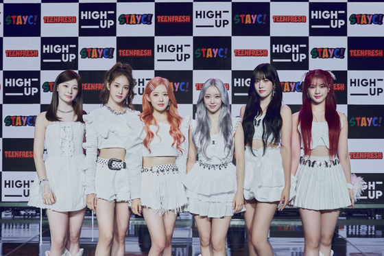 Girl group STAYC poses for the camera during a showcase for the group's latest album ″Teenfresh″ in southern Seoul on Wednesday ahead of the album release. [HIGH UP ENTERTAINMENT]