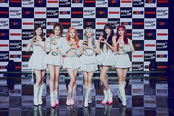 Girl group STAYC poses for the camera during a showcase for the group's latest album ″Teenfresh″ in southern Seoul on Wednesday ahead of the album release. [HIGH UP ENTERTAINMENT]