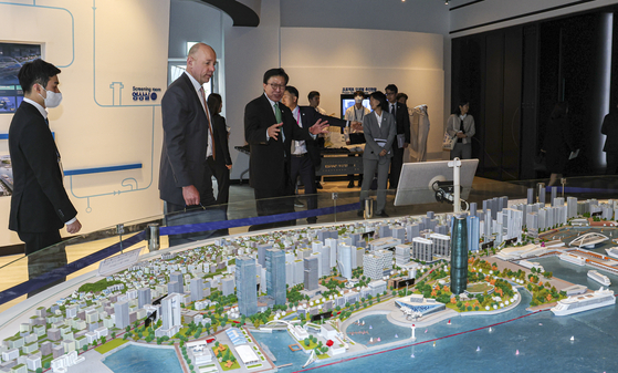 Delegates of the Bureau International des Expositions (BIE) visit the Busan Port International Exhibition and Convention Center on April 5 to hear about North Port where the 2030 World Expo will be held if Busan wins the bid. [JOINT PRESS CORPS] 