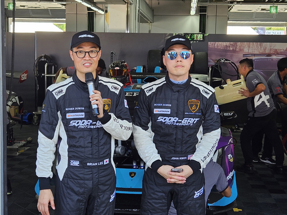 Lee Chang-woo, left, and Kwon Hyung-jin of SQDA-GRIT Motorsport, speak to reporters at Inje Speedium in Inje, Gangwon on Friday ahead of Saturday's Lamborghini Super Trofeo Asia race. [PAIK JI-HWAN]