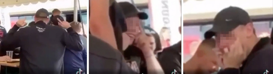 Screen captures of a video posted on TikTok show football fans making racist gestures at a Korean fan in an FC Midtjylland fan zone outside of the MCH Arena in Herning, Denmark on Thursday. The club later identified the individuals as Danish FC Midtjylland fans.  [SCREEN CAPTURE]