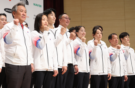From left: Korean Sport & Olympic Committee (KSOC) Chairman Lee Kee-heung, sport climber Seo Chae-hyun, break dancer Kim Heon-woo, Head of the Jincheon National Team Training Center Jang Jae-keun, table tennis player Shin Yu-bin, jiujitsu practitioner Sung Ki-ra, wrestling Head Coach Yoo Bae-hee and wrestler Kim Hyeon-woo pose for a photo during a media day at the Jincheon National Training Center in Jincheon, North Chungcheong on Thursday to mark 30 days until the Hangzhou Asian Games kicks off in China on Sept. 23. KSOC announced at the event that Team Korea is aiming to finish third overall. A total of 12,500 athletes from 45 Asian countries will compete across 40 disciplines at the tournament. [YONHAP] 