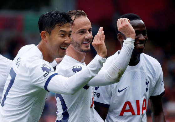 Tottenham Hotspur's James Maddison, center, celebrates scoring the opening goal with Son Heung-min, left, and Pape Matar Sarr in a game against Bournemouth at Vitality Stadium in Bournemouth, England on Saturday.  [REUTERS/YONHAP]