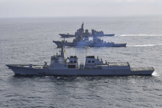 The ROKS Yulgok Yi I, USS Benfold and JS Atago take part in a joint missile defense exercise off South Korea's east coast on April 17. [REPUBLIC OF KOREA NAVY]