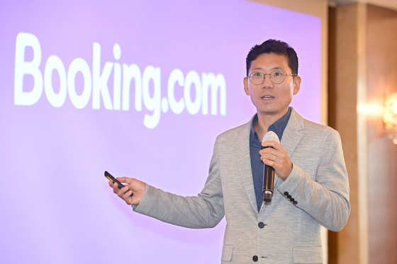 Area manager Chris Kim gives an overview of Booking.com's efforts in Korea at Lotte Hotel Seoul in Jung District, central Seoul, on Tuesday. [BOOKING.COM]