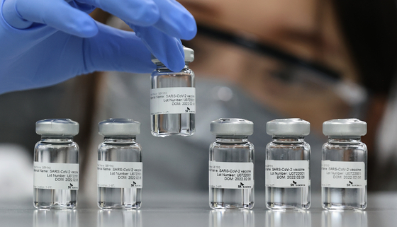 A researcher holds a vial of SKYCovione vaccine, developed and manufactured by SK bioscience [JOINT PRESS CORP]